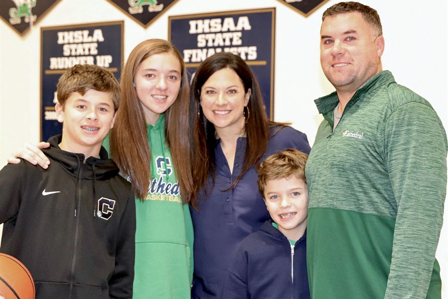 The Finns stand on the Welch Activity Center court. They are, from left Max Finn, senior Mia Finn, Mrs. Lisa Finn, Luke Finn and Mr. Billy Finn.