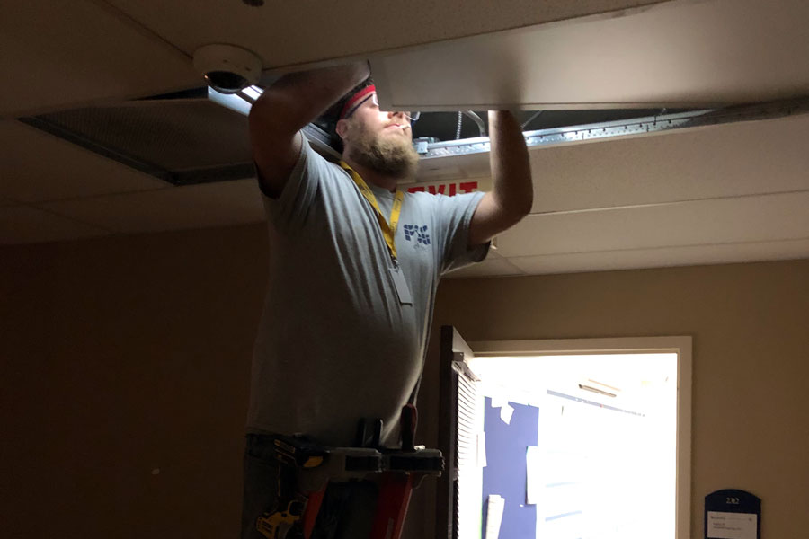 On Jan. 8, a worker installed new LED lighting in the hallway outside the classroom of Mrs. Lisa Blamey.