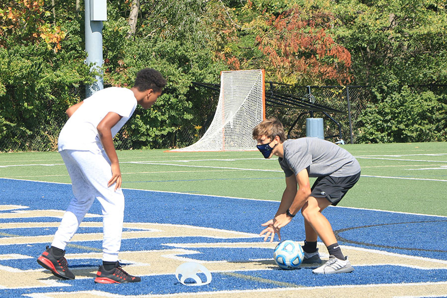 During a warm afternoon last fall, senior peer mentors took their freshman resource students to the football practice field to participate in a get-to-know-you activity.
