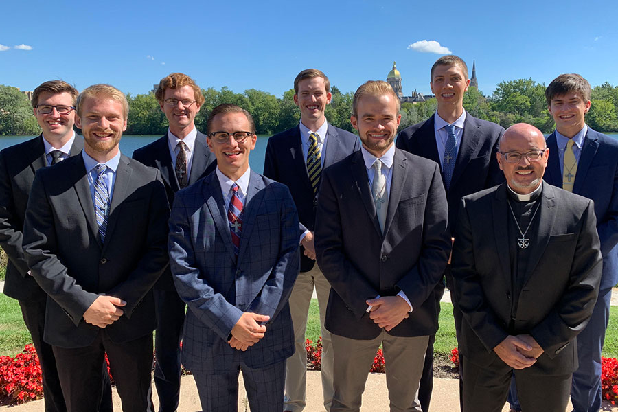 Mr. Ben Sasin ‘14, third from left in the front row, has answered God’s call to become a priest. On the campus at Notre Dame, he stands with his cohort group that is pursuing a master’s degree as part of each postulate’s preparation for entering the priesthood.