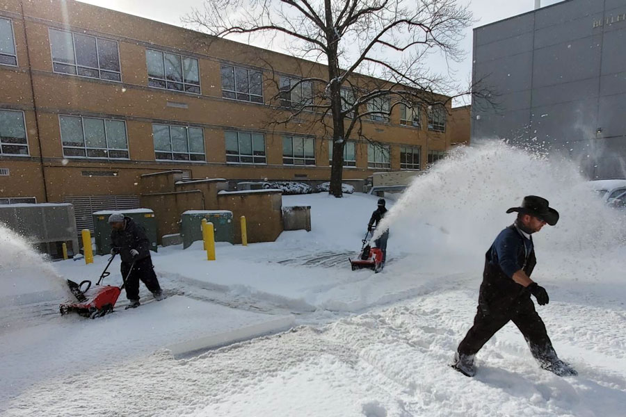 While you were cozy and warm in front of your iPad during the eLearning  day on Feb. 16, crews were spending hours removing snow from the parking lots and sidewalks. 