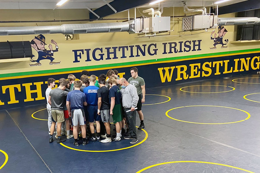 Wrestlers and coaches after after a recent practice. 