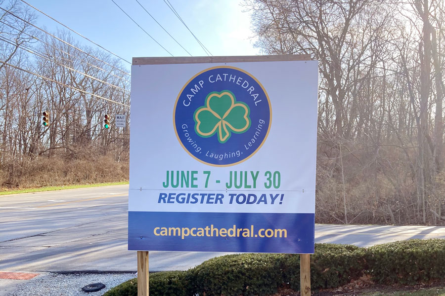 A sign at the bottom of the Hill on East 56th Street promotes this summer's Camp Cathedral. 