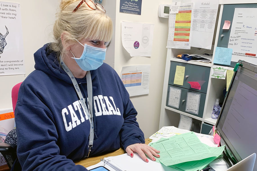 School nurse Mrs. Marianne Vogt '86 works in her office during E period on March 5. 