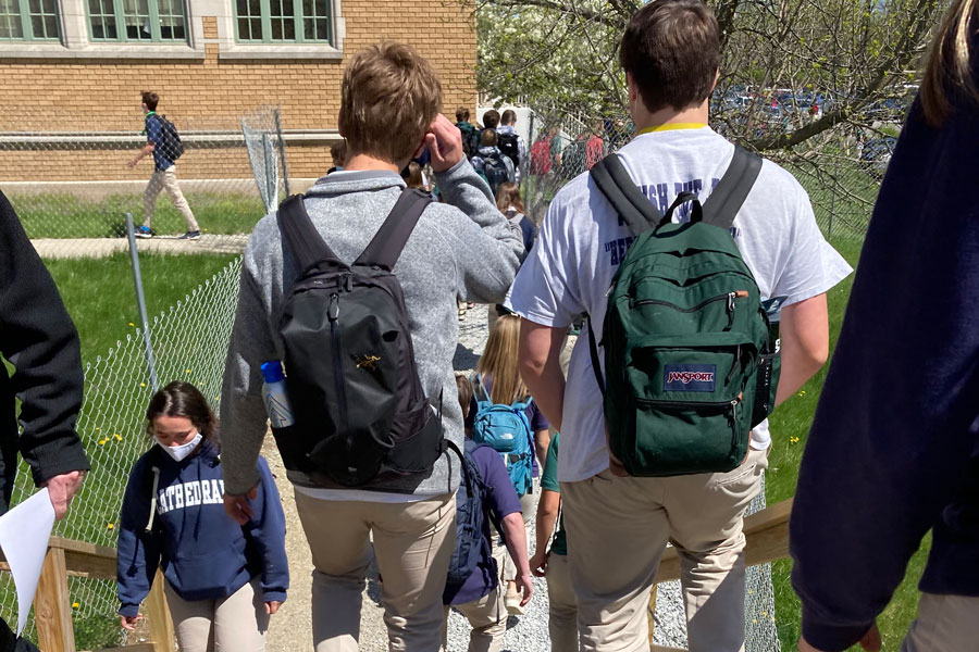 Students walk from Kelly to Loretto on April 14 during a passing period. The lengths of next years passing periods are pretty much set, but other details of the daily schedule have yet to be determined, according to Principal Mrs. Julie Barthel. 