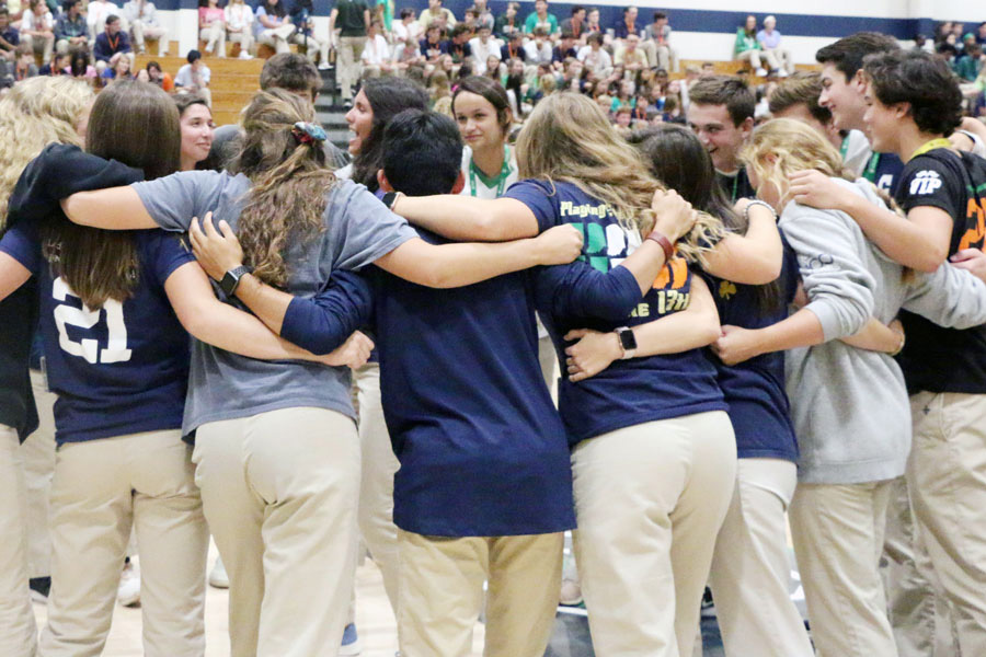 During the welcome assembly two years ago, Student Council members huddle up before the event. 