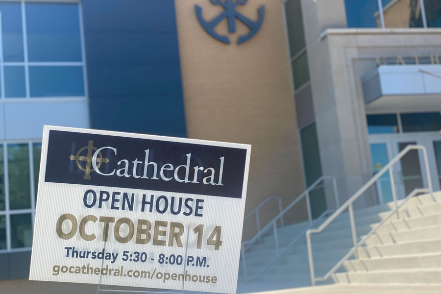 A sign outside the main entrance promotes this year's Open House. 