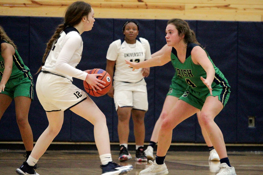 During the varsity’s 66-33 win over University on Nov. 16, senior Katie Bremer plays in-your-face defense. Bremer led the Irish in scoring during the game, hitting six of nine shots from the field and totaling 14 points.