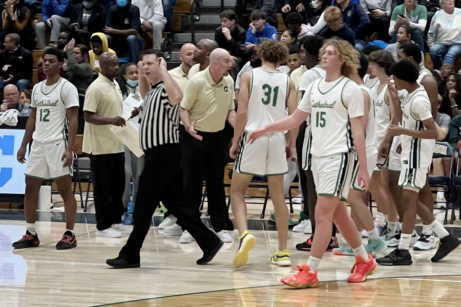 At the end of a timeout, Head Coach Mr. Jason Delaney gives instructions to his team, which would go on to beat Brebeuf Jesuit 63-61 in overtime. 