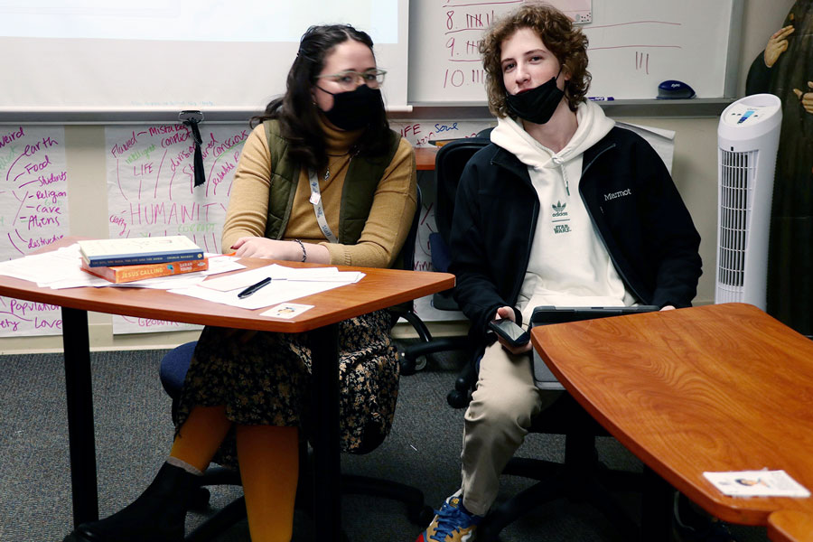 During J-Term, English teacher Miss Irene Wilson and senior Theo Foglio wear masks. The school nurse noted that the number of Covid cases increased during those two weeks in January, but have fallen significantly since then, which results in masks now being optional on campus.