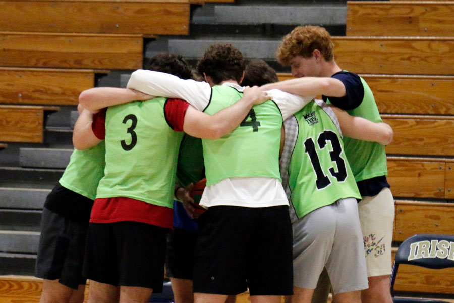 One of the teams that in last year's intramurals championship game huddles before the tip off. 