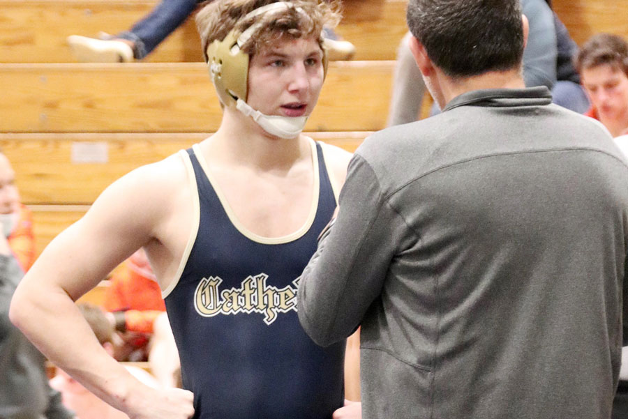 During a match earlier this season, senior JJ Braun receives instructions from a coach. The wrestling team won the Regional title on Feb. 5 and will compete in the Semistate at New Castle on Feb. 12.