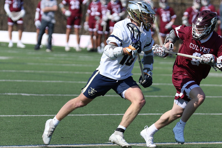 While most spring sports have not yet begun their varsity season, the men’s lacrosse team already has competed. Senior Johnny Kraege dodges against Culver. During spring break, athletes will maintain their conditioning and workout routines in order to stay in shape. 