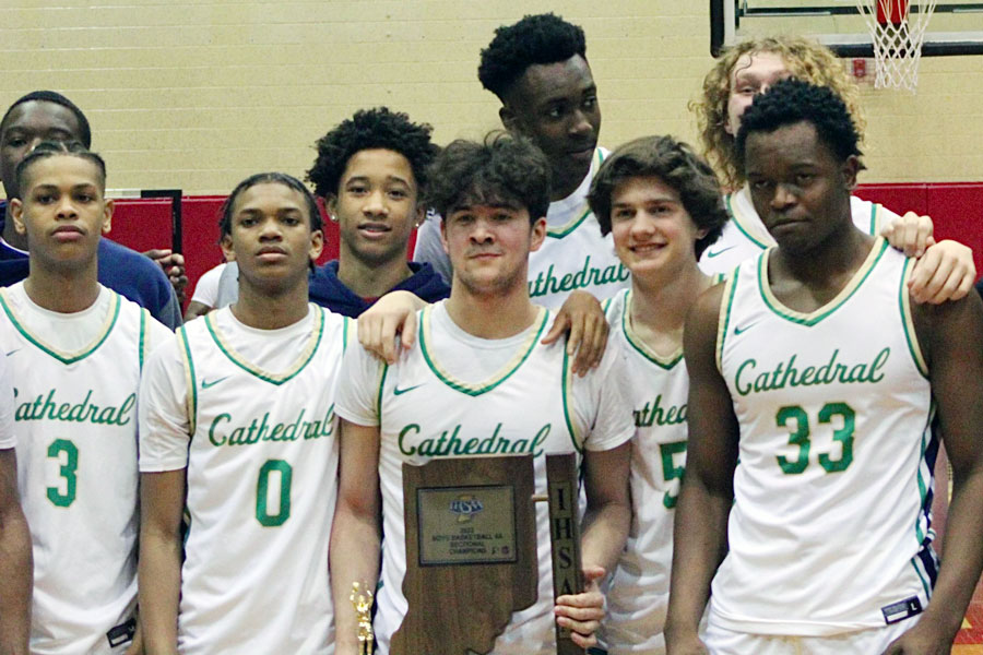 Members of the team stand with the Sectional trophy after the Irish defeated Lawrence North in the championship game at North Central on March 5. 