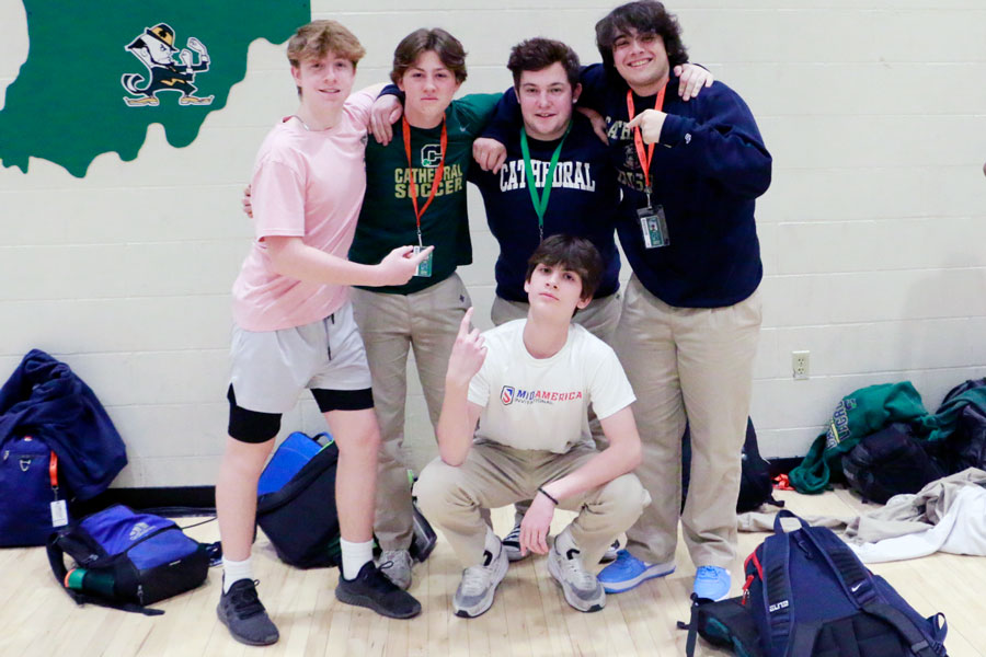 During his C period physical education class, sophomore Daniel Kuskov, standing third from left, gathers with several of his classmates and new friends.