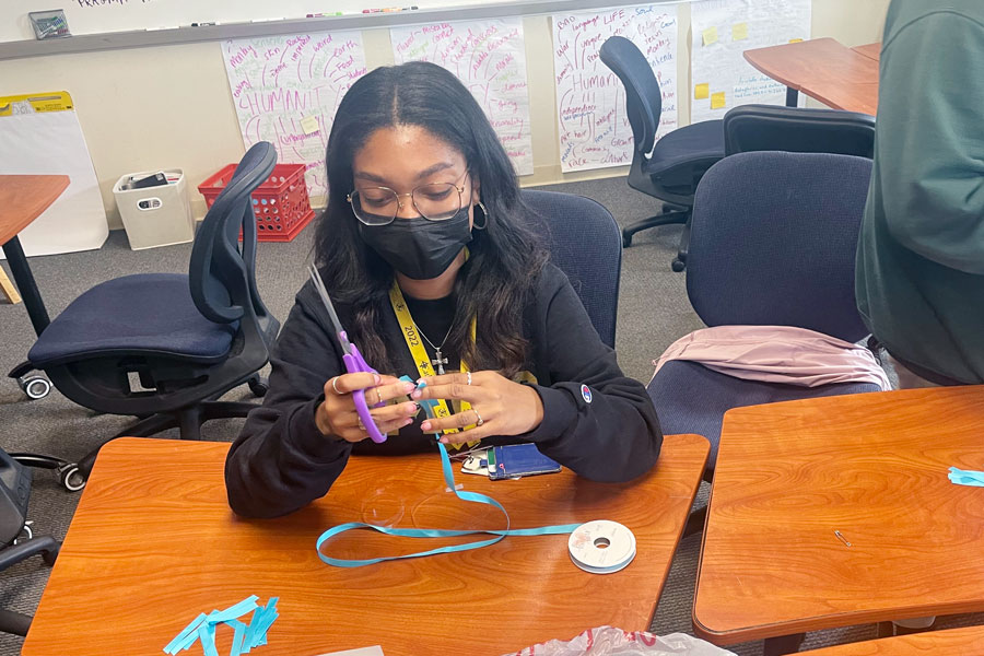 On April 25, Empowering Healthy Minds Club members worked to create ribbons to share with fellow students to spread awareness about sexual assault. 