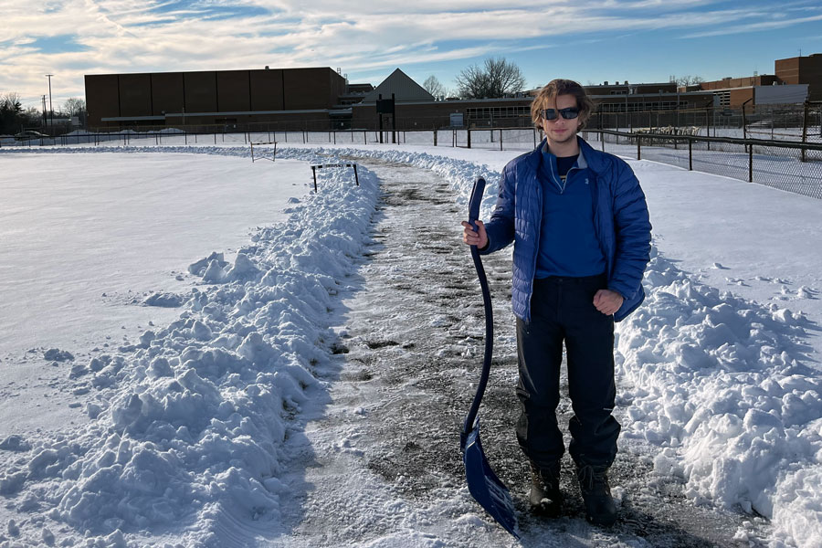 Part of junior Liam Eifert's community service included shoveling the track at Arlington Middle School on a snowy February afternoon. 