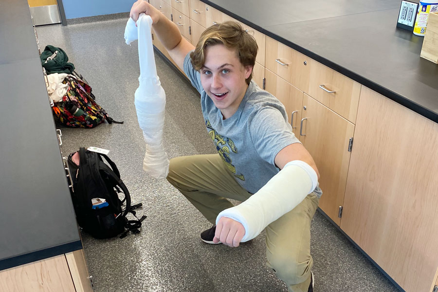 Medical Club president junior Henry Staggs poses after a meeting during which club members learned how to put on a cast. 