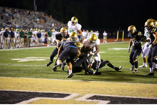 Jaron Tibbs Extends out while being tackled to score a touchdown against Penn.