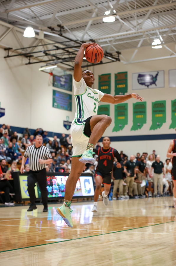 Senior Kamari Slaughter elevates for a dunk against Fort Wayne North Side on Nov. 22. Slaughter had 12 points in a 93-45 Irish victory.