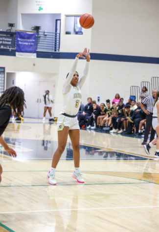 Senior Layla Gold attempts a free throw in a game against Warren Central on Nov. 8. Gold scored 31 points in a 45-44 Irish victory.