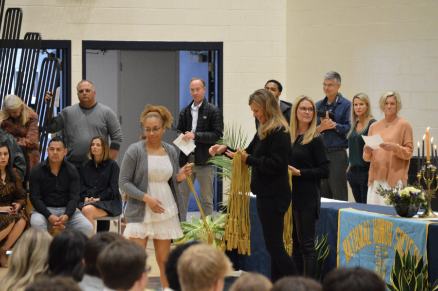 Mrs. Gretchen Watko ‘00 and Ms. Jenny Myers handing out the honor cords to the senior
National Honor Society members.