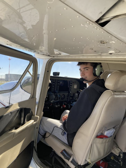 Christian sits up in the pilots chair. His first solo flight took place last month.