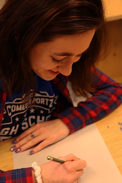 Senior Sophia Mathioudakis writes calligraphy on Feb. 3 during Flex.