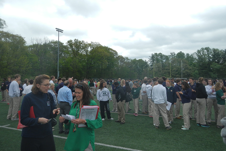 Students line up according to their irish counties on the football field.