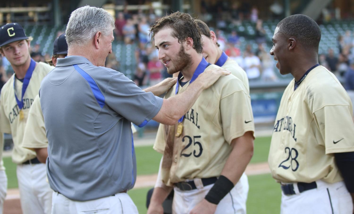 President Dave Worland congratulates senior Jared Poland 