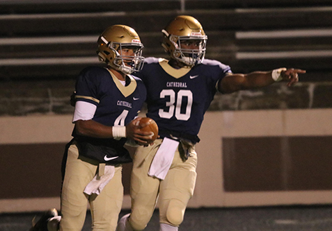 Senior running back Markese Stepp celebrates with sophomore quarterback Roman Purcell after his rushing touchdown against Decatur Central in the Sectional championship. The Irish won the game 42-21 and will host Columbus East Nov. 17 at Tech to determine who gets to play for the Class5A State championship during Thanksgiving weekend at Lucas Oil Stadium.