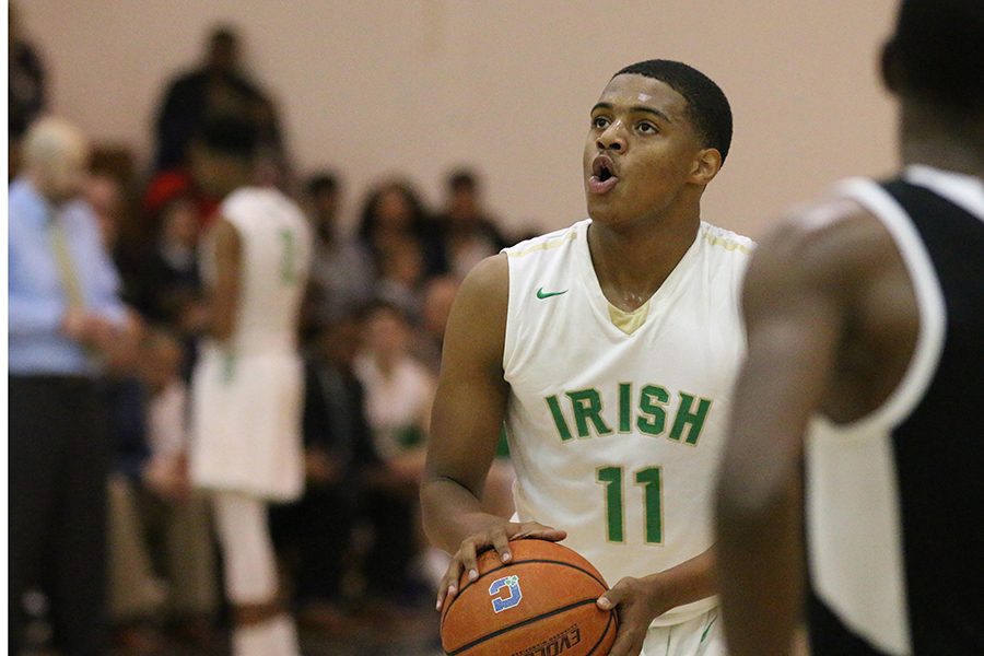 Senior Jarron Coleman eyes the basket during one of his successful free throw attempts on Dec. 1 during the team's win over Howe. 