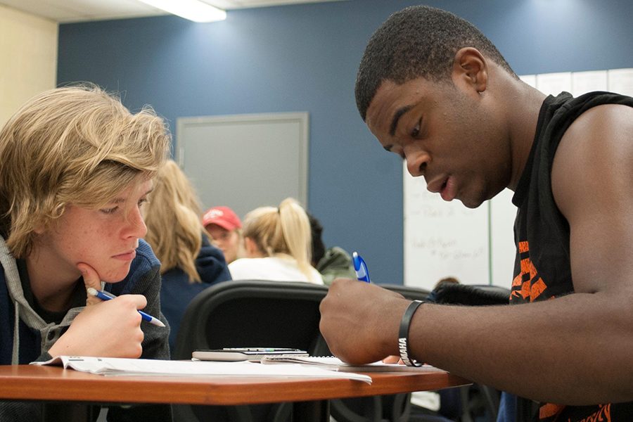 Students in a math class work to solve a homework problem. The Feb. 26 ISTEP will include two math sections. 