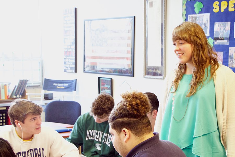 Theology teacher Ms. Katie Klee interacts with students in her E period class. She also teaches Confirmation classes at Pendleton. 