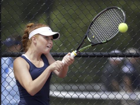 Senior Maeve Koscielski returns a volley in a match last spring.