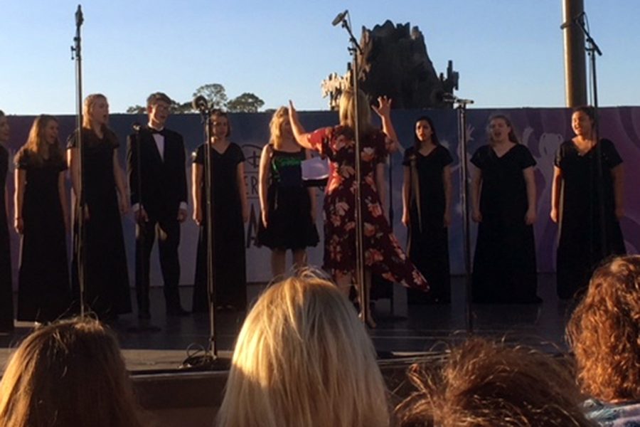 The choir, under the direction of Mrs. Marian Bender, performs in Disney Springs. 