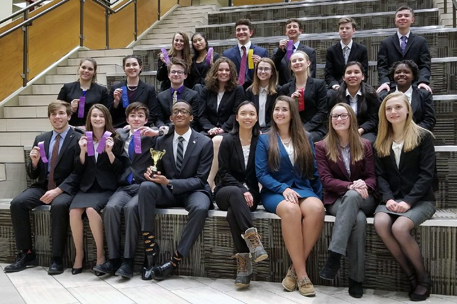 Members of the speech team pose with their awards after a successful meet.