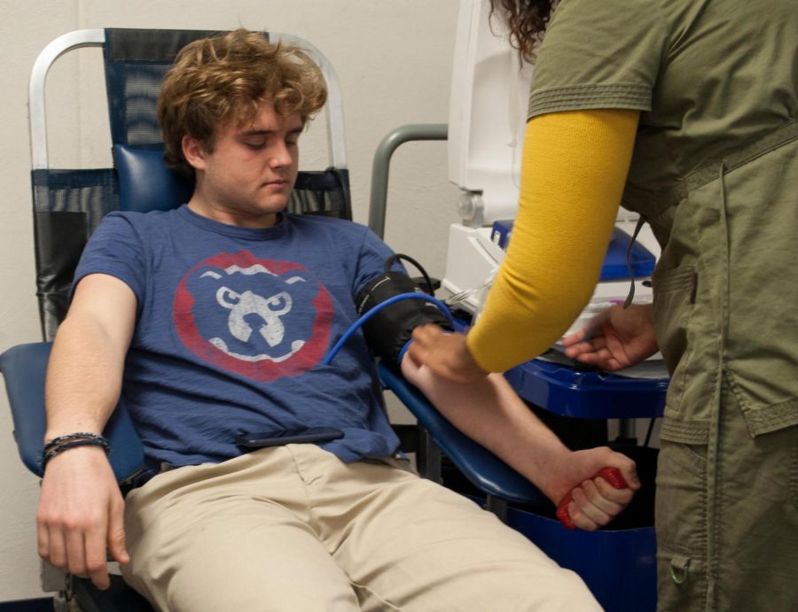 Junior Bobby Welch donates during a blood drive that took place earlier this school year. 