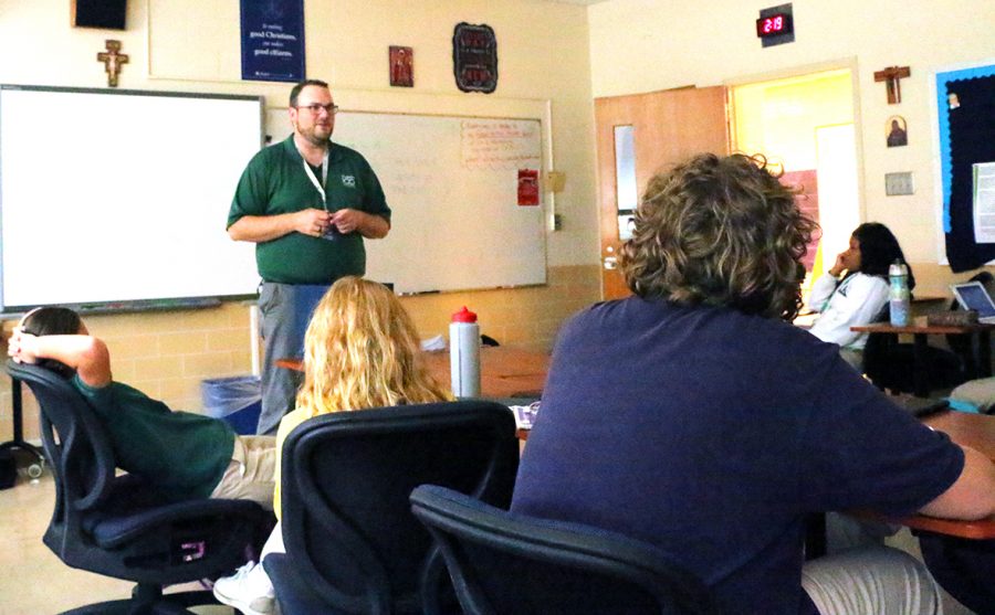 Theology teacher Mr. Matt Cannaday leads a discussion in a religion class. 