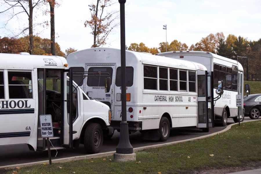 Buses prepare to load students for their trip home. Those buses will make frequent stops, and it’s not uncommon for drivers to illegally pass, according to Mr. Ken Kaufman, director of transportation.