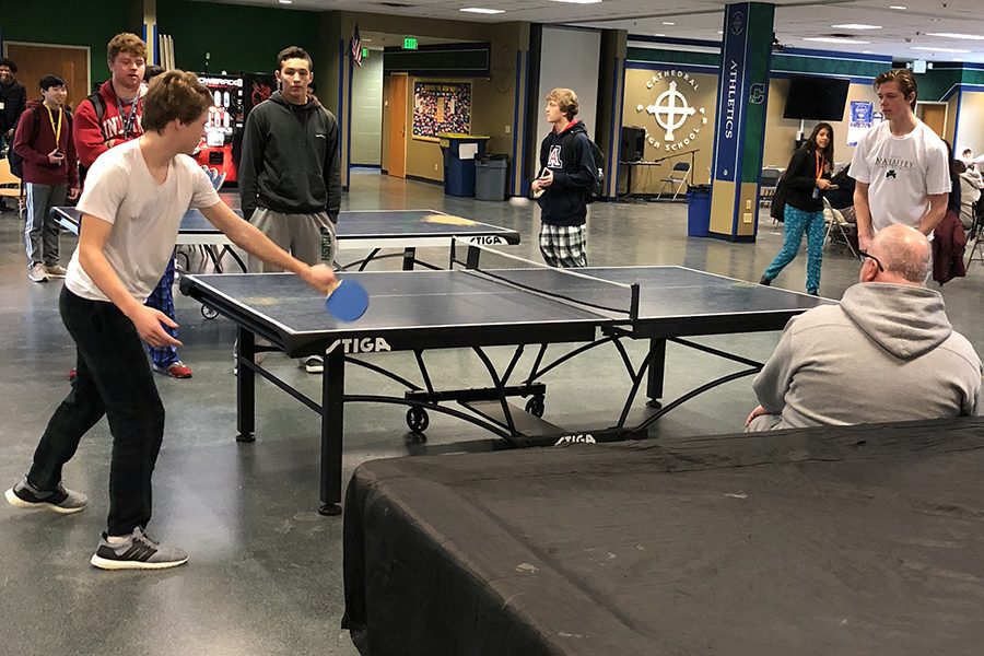 Mr. Anthony Ernst, director of student activities, looks on as two of the eight Golden Paddle finalists compete during flex on Jan. 28. 