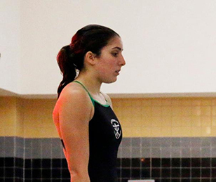 Junior Sophie Mernitz prepares to dive during a regular season meet. Mernitz finished 12th at the State meet, resulting in Cathedral scoring points as a team for the first time in years. 