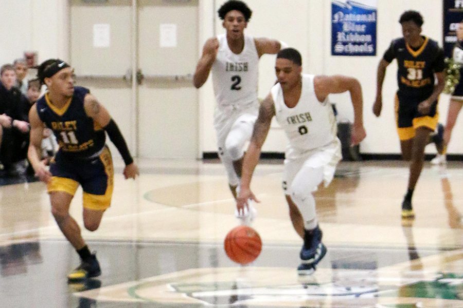 Senior James Franklin brings the ball up the court during the regular season game against South Bend Riley. The varsity will open Sectional play on Feb. 26 at 7:30 against Lawrence North.