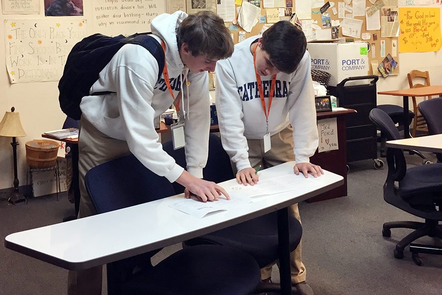 After they took the math competition exam, sophomores Levi Wojtalik and Isaac Michael discuss their solutions. 