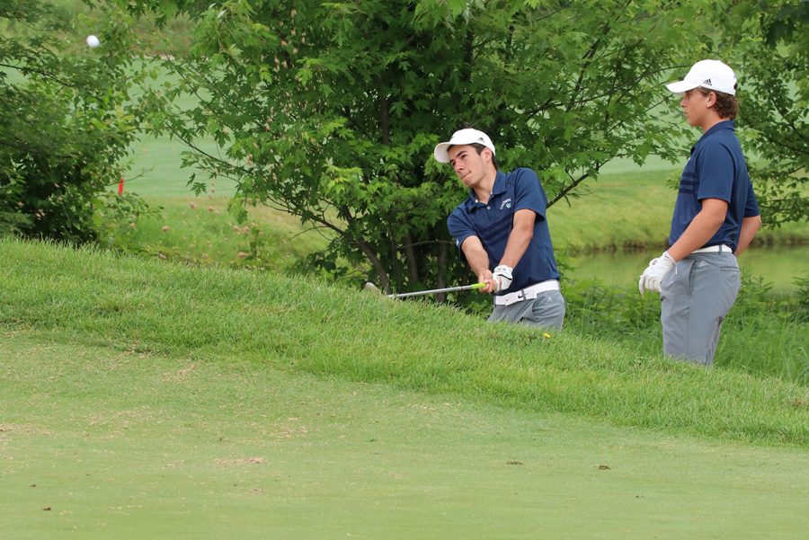 The men's golf team warms up for the first hole at last year's State Finals in Carmel. 