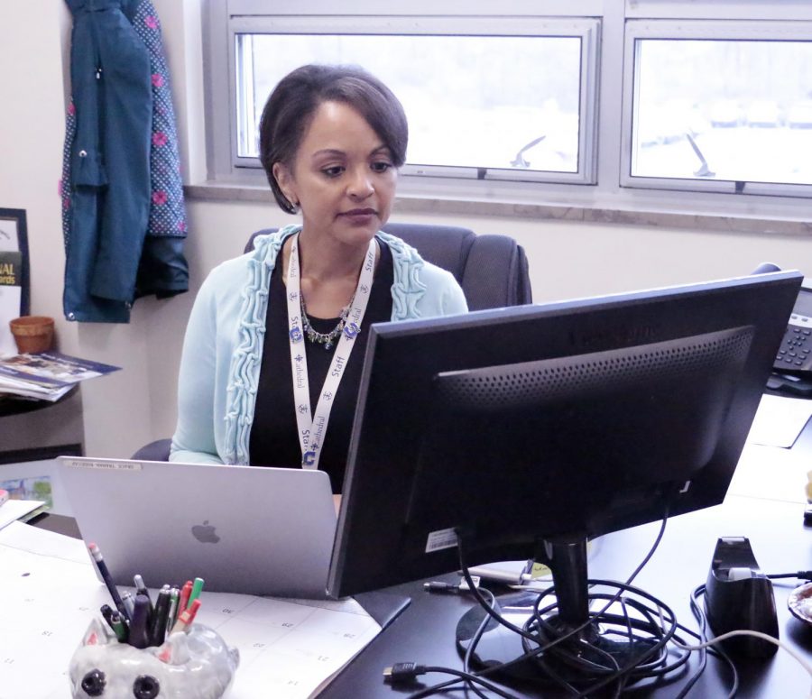 Mrs. Grace Rodecap works in her office. 