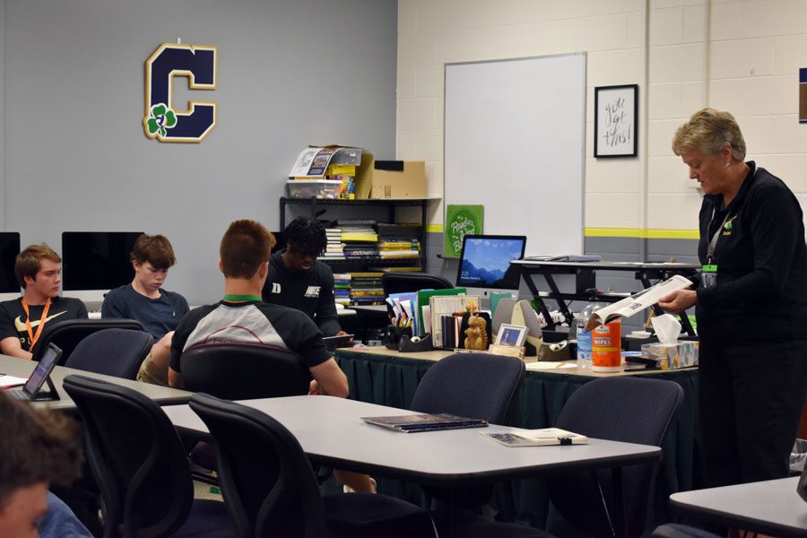 Ms. Jean Kesterson instructs a personal finance class that teaches students real-world money skills. 