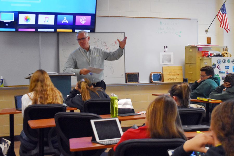 Social studies teacher Mark Mathews teaches his E period dual credit  American history class.