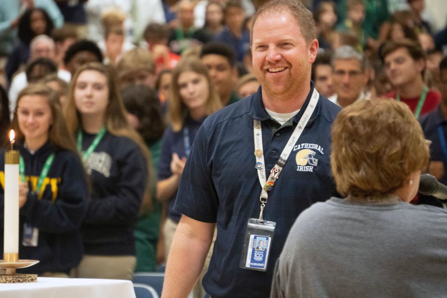 Mr. Jere Kubuske takes the floor at the welcome back Mass at the start of the school year. 