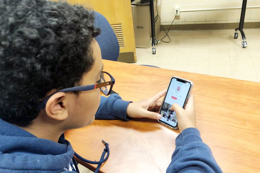 Students often check out TikTok during their resource. Freshman Adriel Jose views a video during G period. 